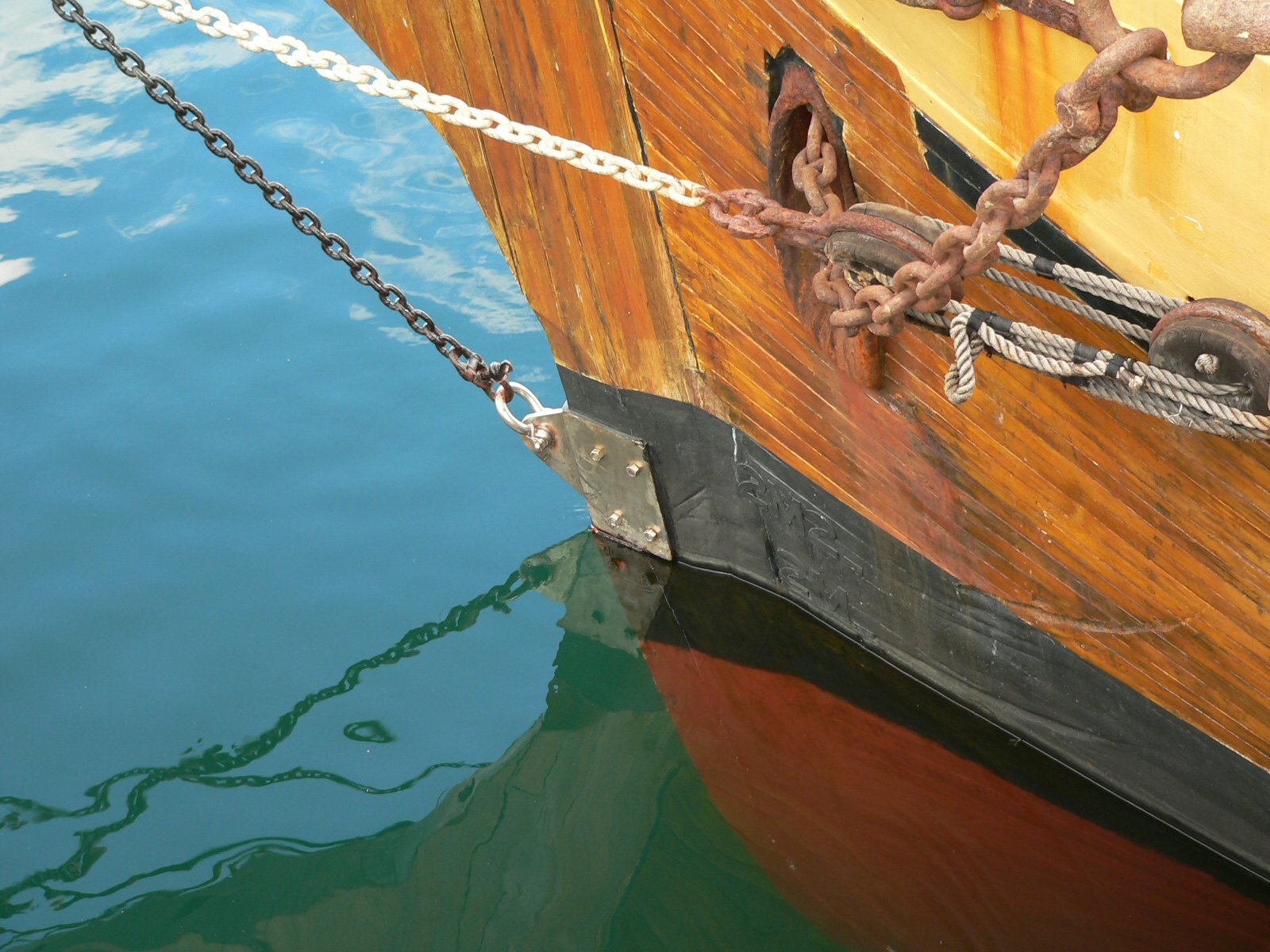 a close up of a boat and a chain