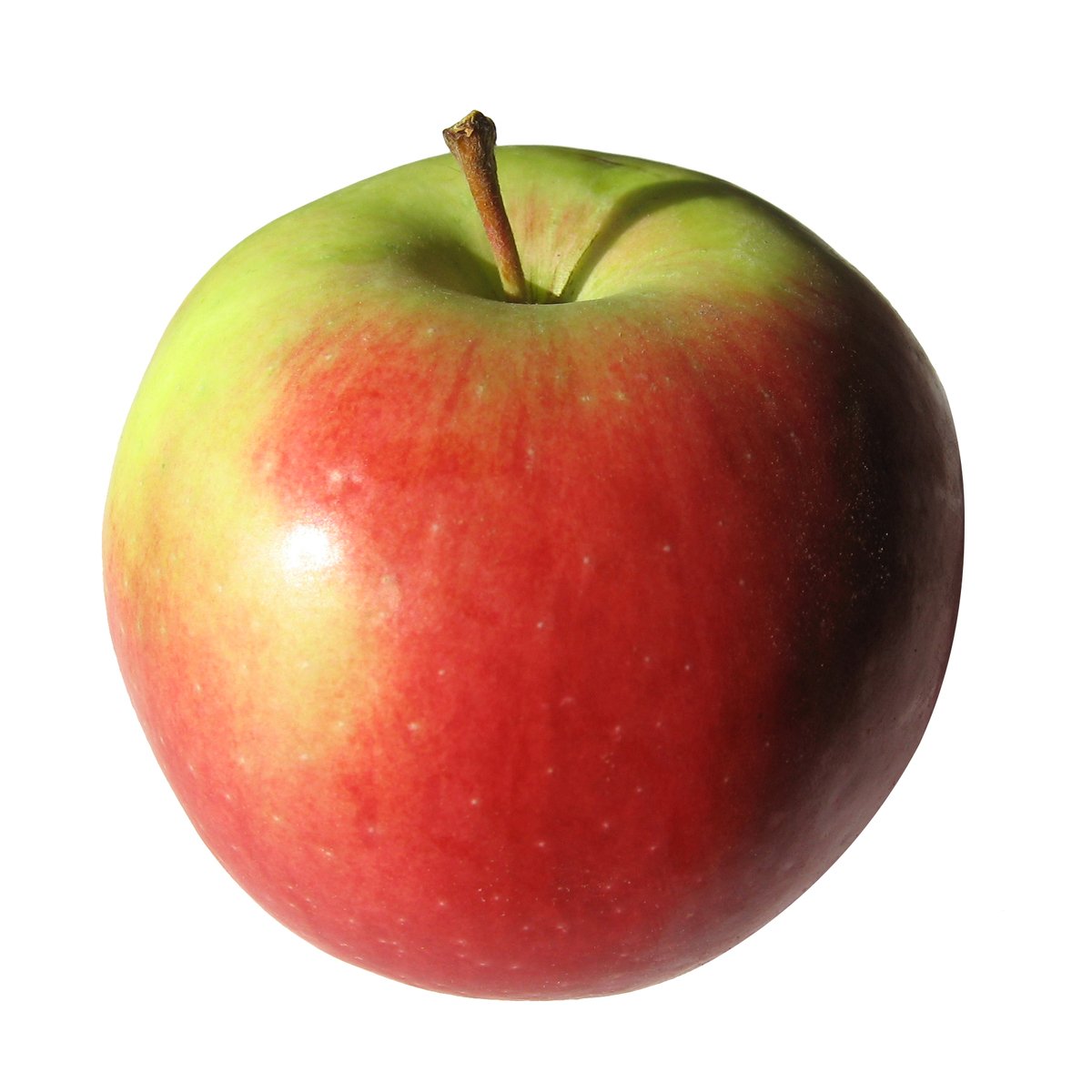 an apple that is sitting on a white surface