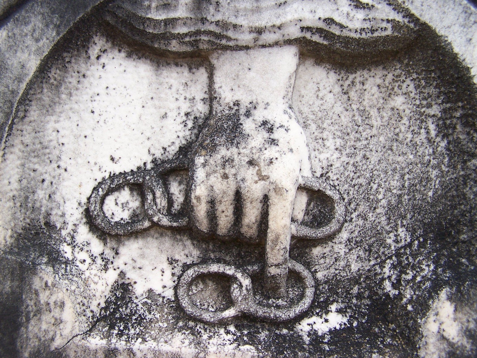 a close up of a picture of the hand on a white marble