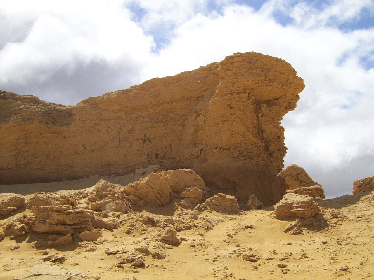 the cliff is made of sand and some rocks