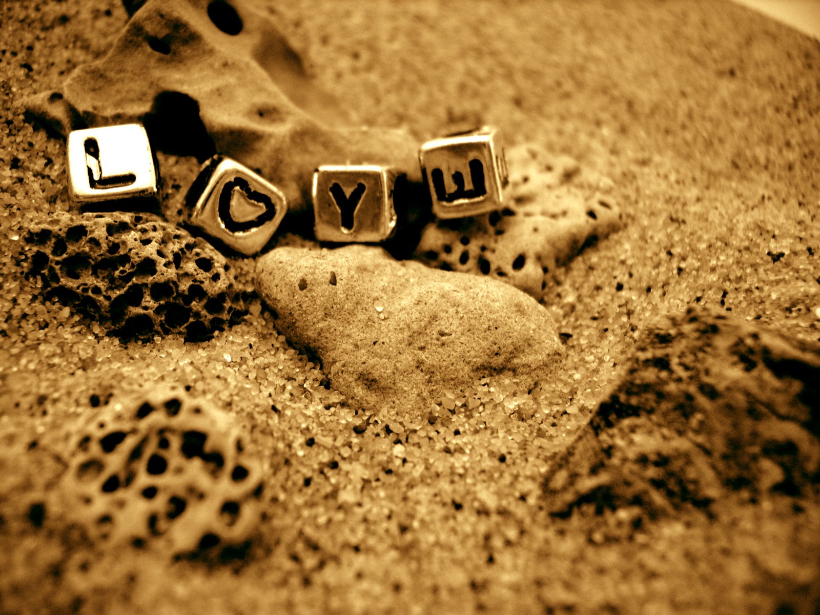a word made out of wooden blocks with the word love spelled on top