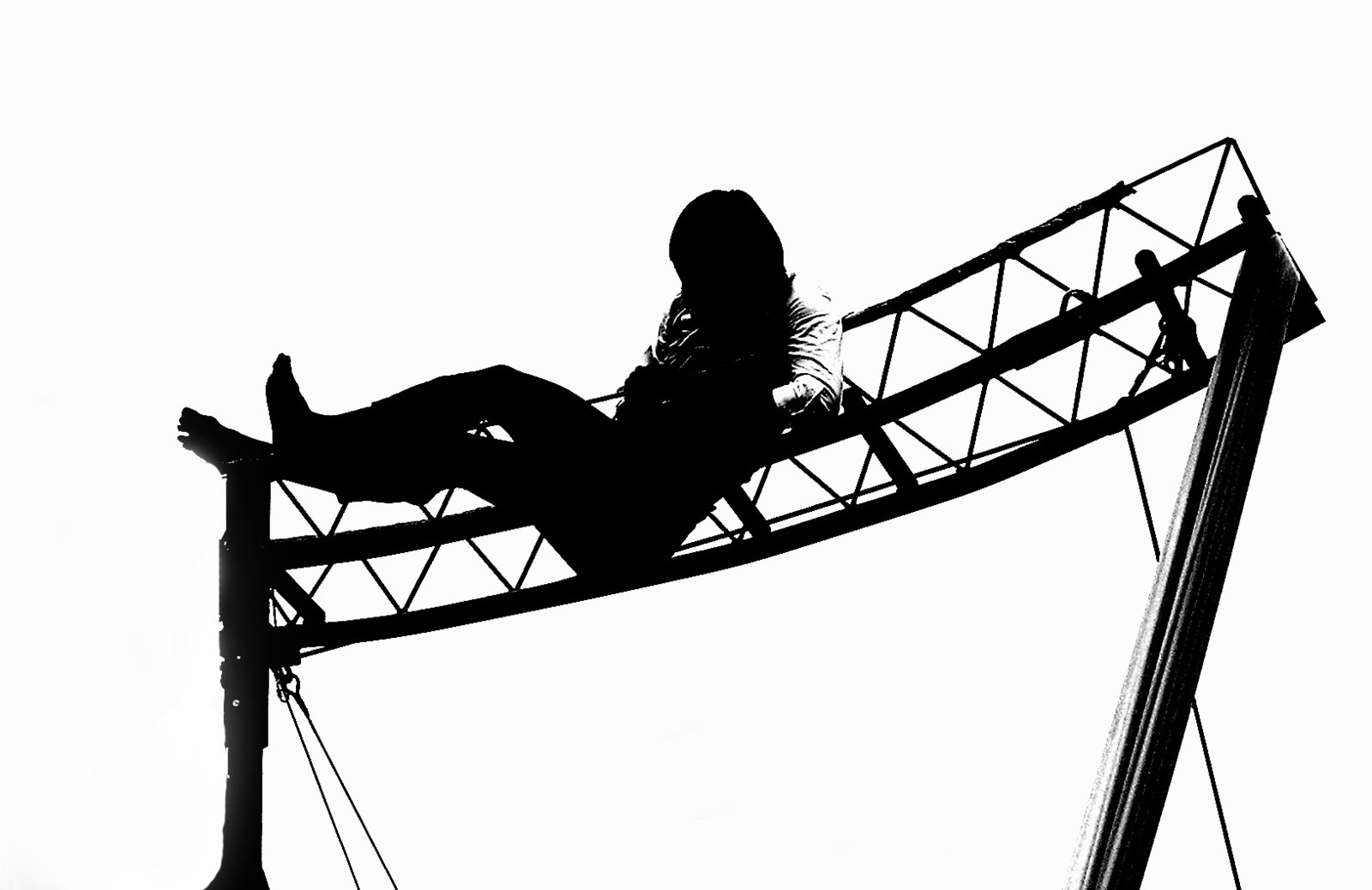 black and white silhouette of a woman riding a ride