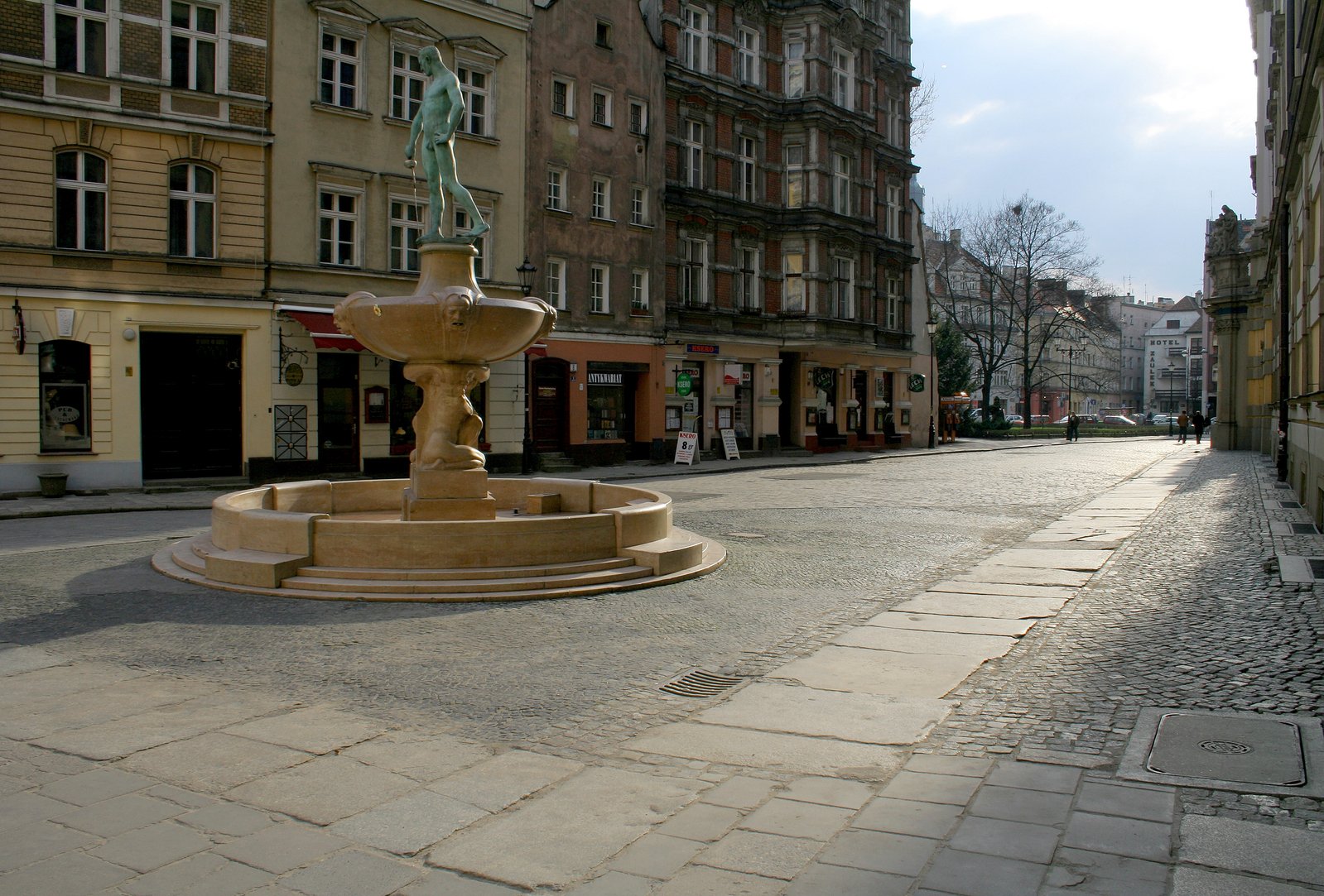 a large square has a fountain in the center