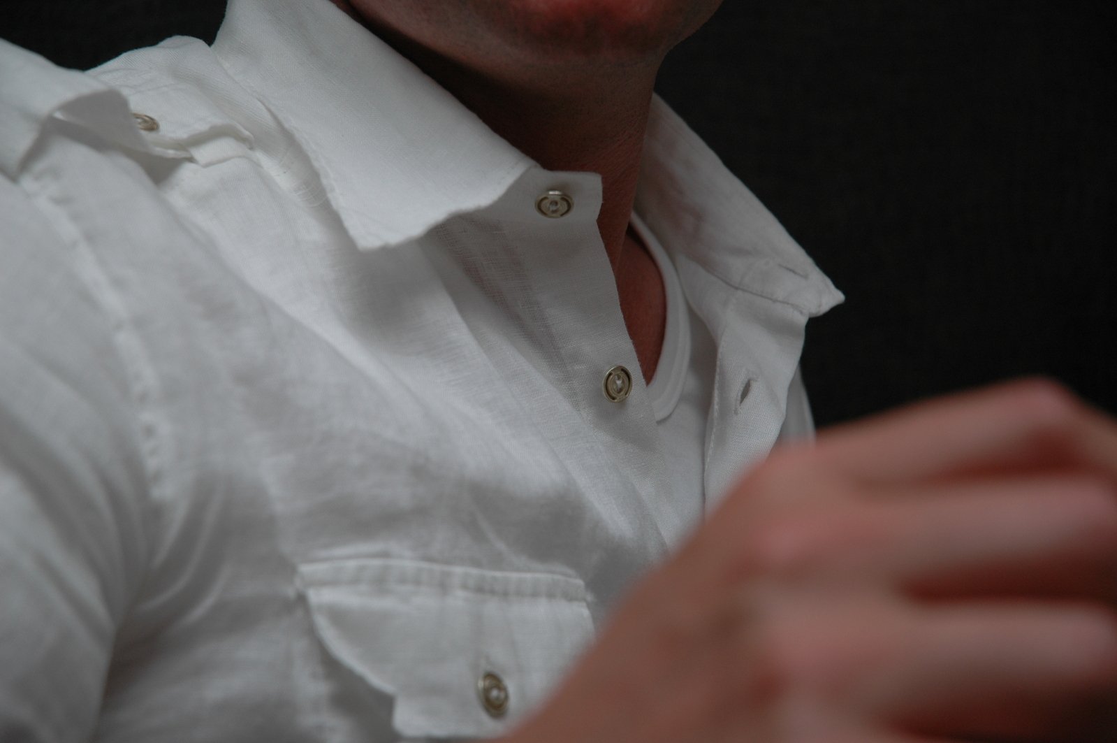 a man is wearing a white shirt and red lipstick