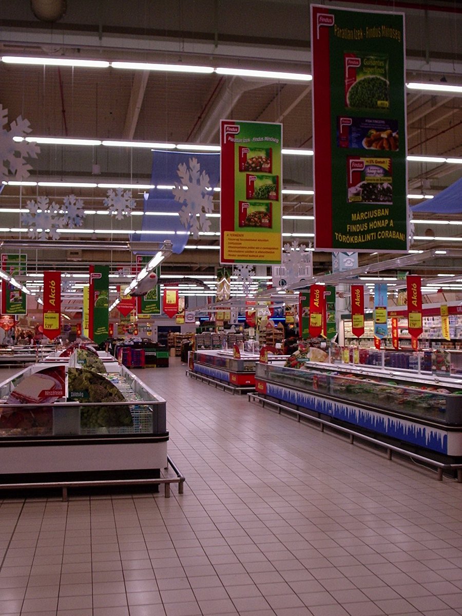 a produce section of a market is shown with banners