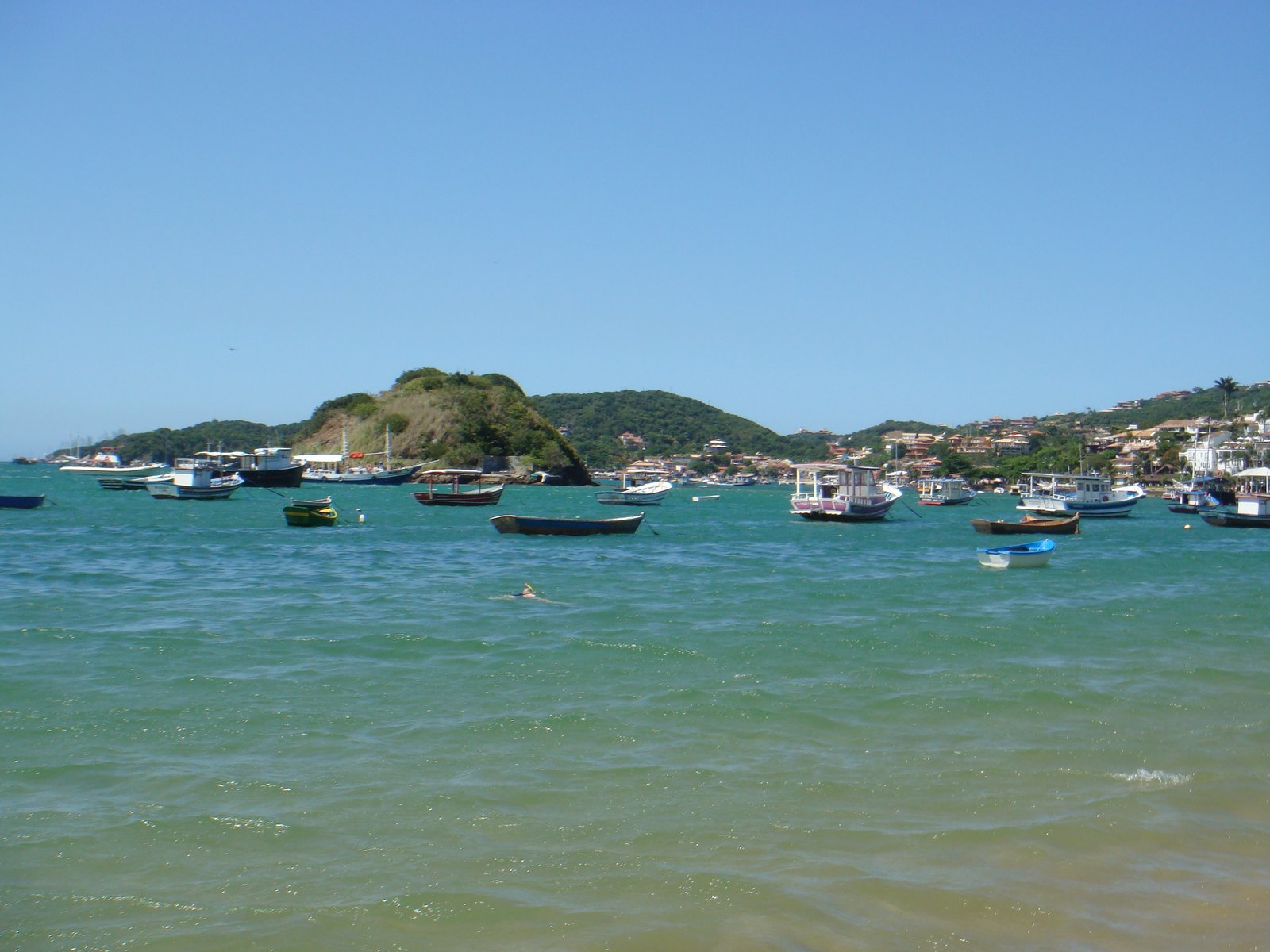 the boats are in the calm blue water