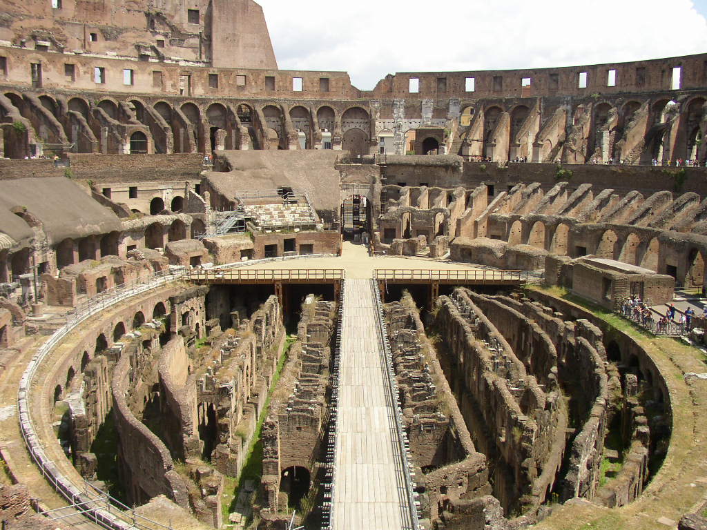 inside of an ancient building with multiple steps and columns