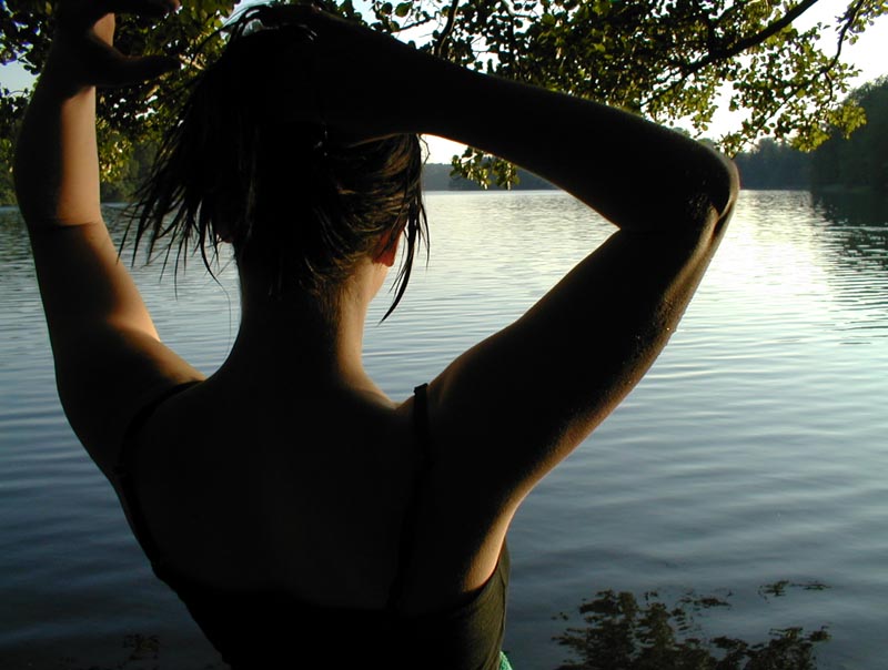 woman looking out at a body of water