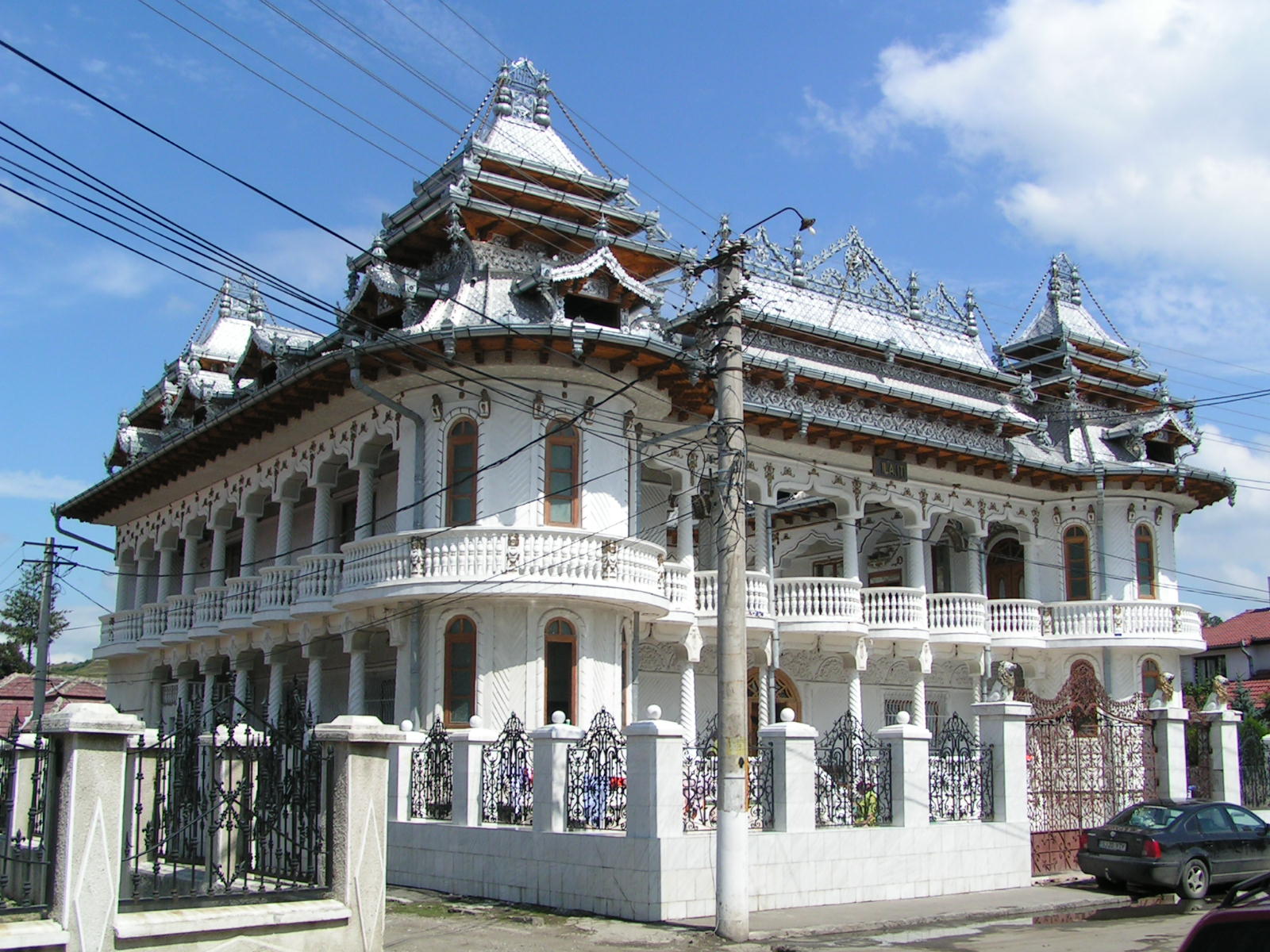 a tall building with many balconies and ornate towers