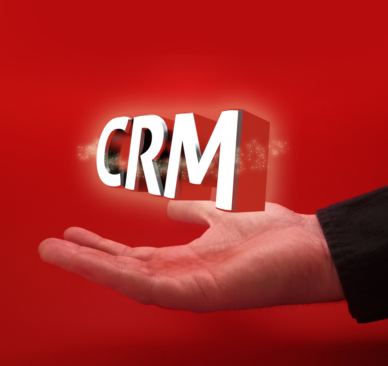 a person's hand reaching out towards the word crm