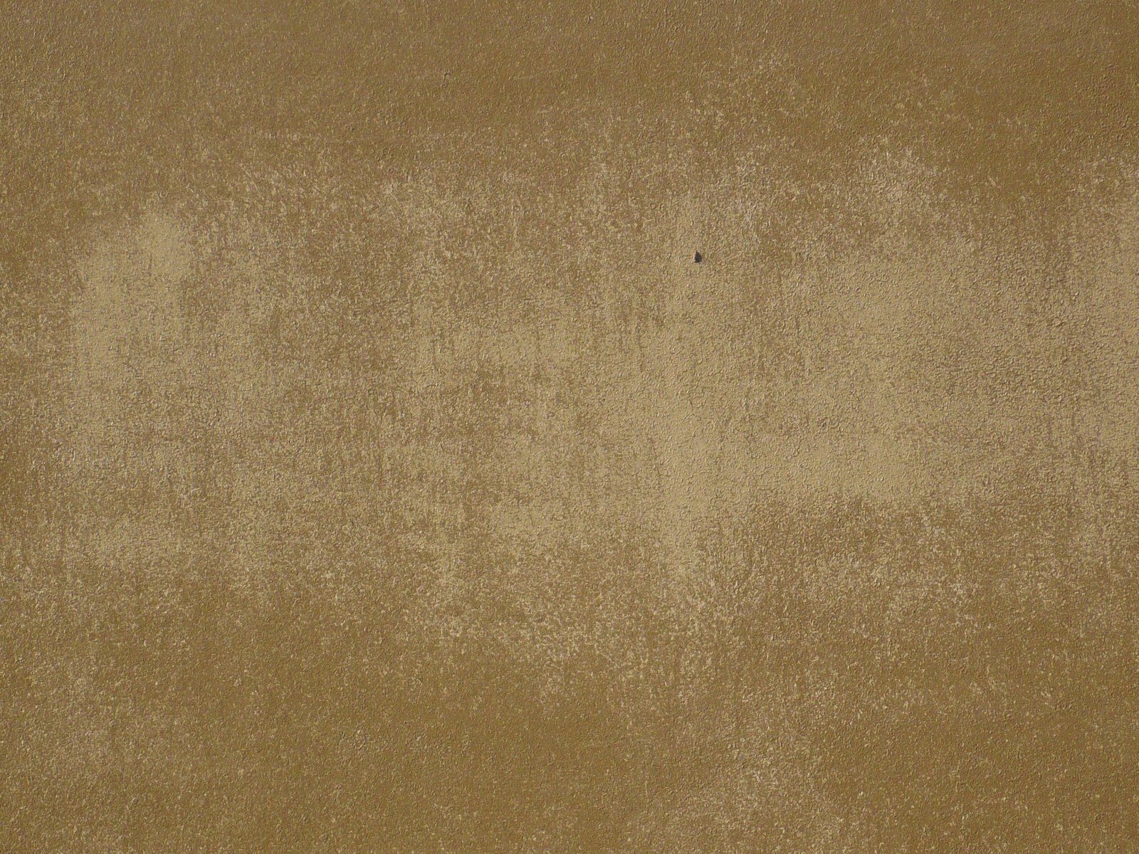 a beige carpet with some stains on it