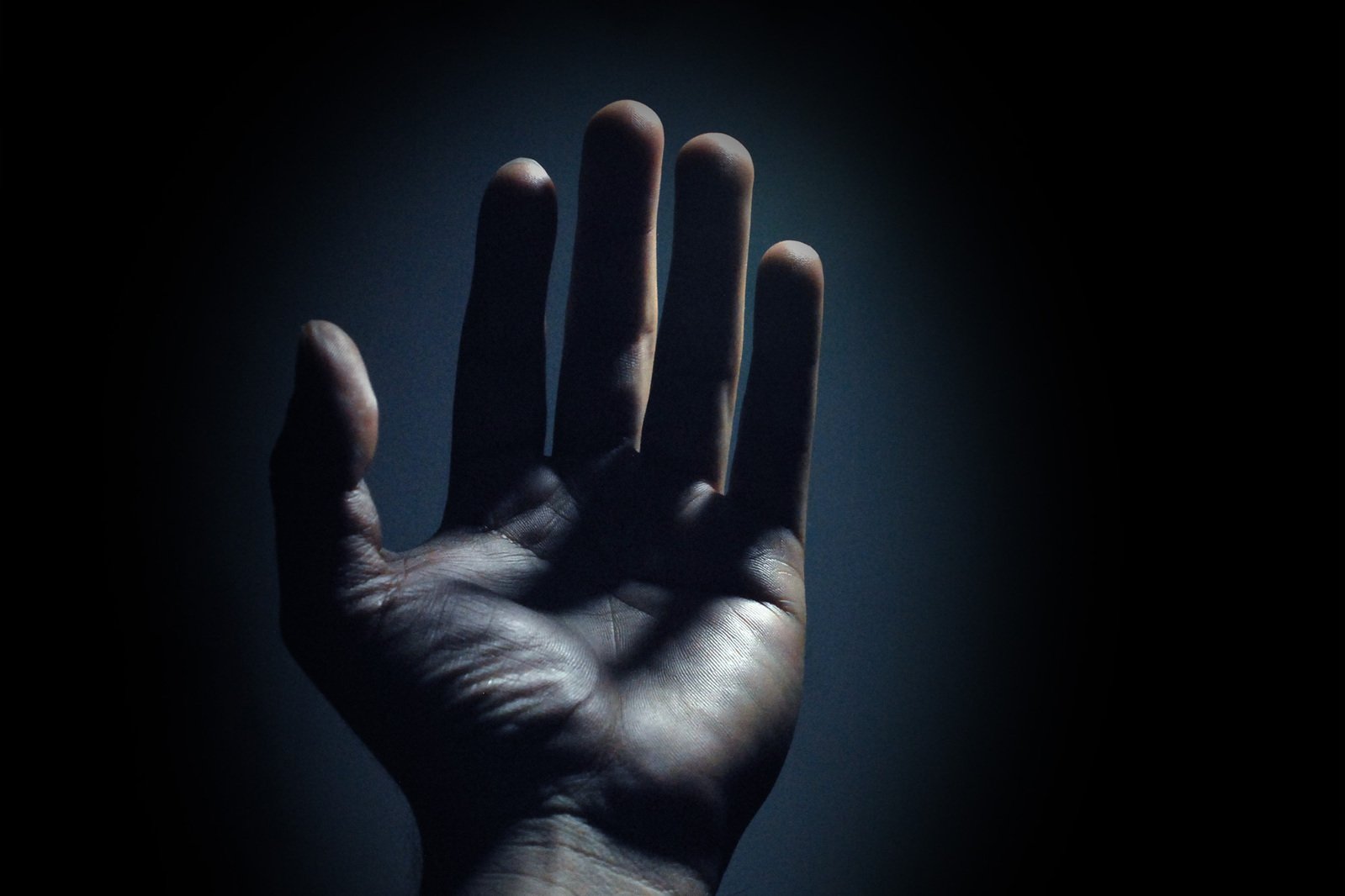 a hand that is held in the dark