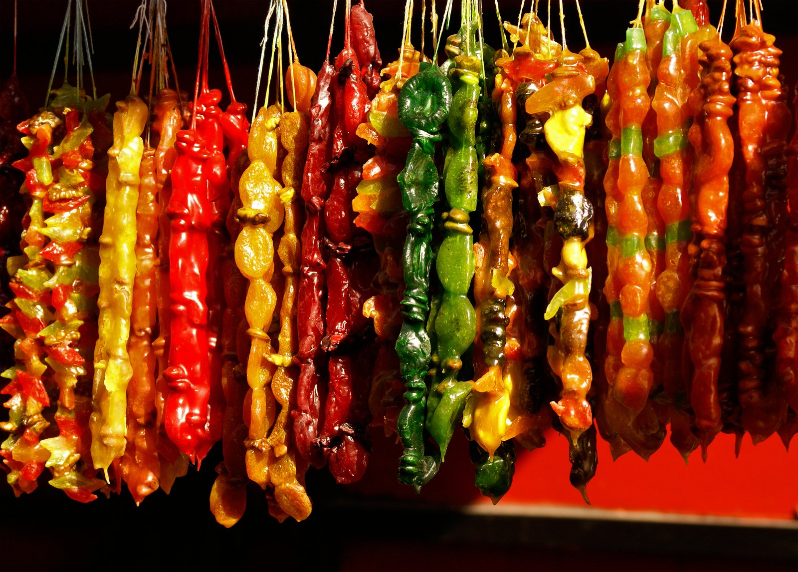 different kinds of skewers that are hanging up