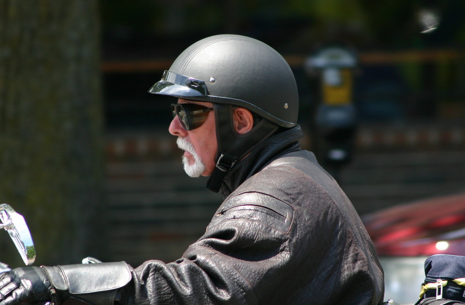 a man in full safety gear on a motorcycle