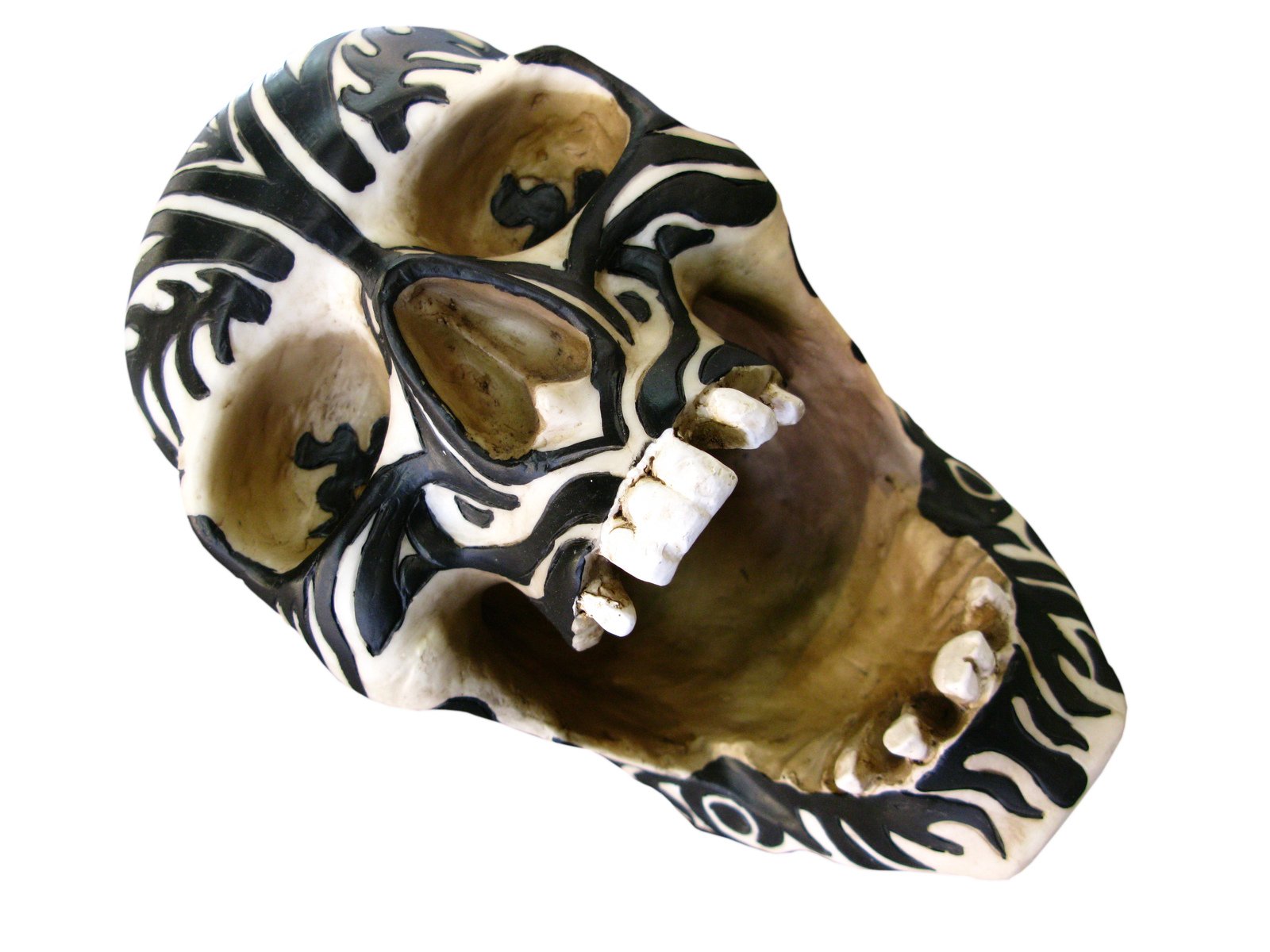 an artistic mask with white and black designs on it