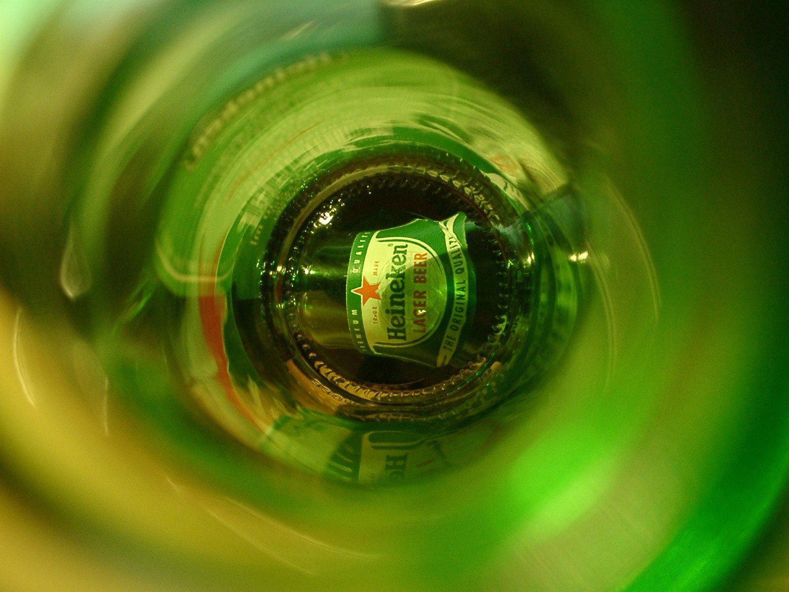 a soda bottle s in a green glass