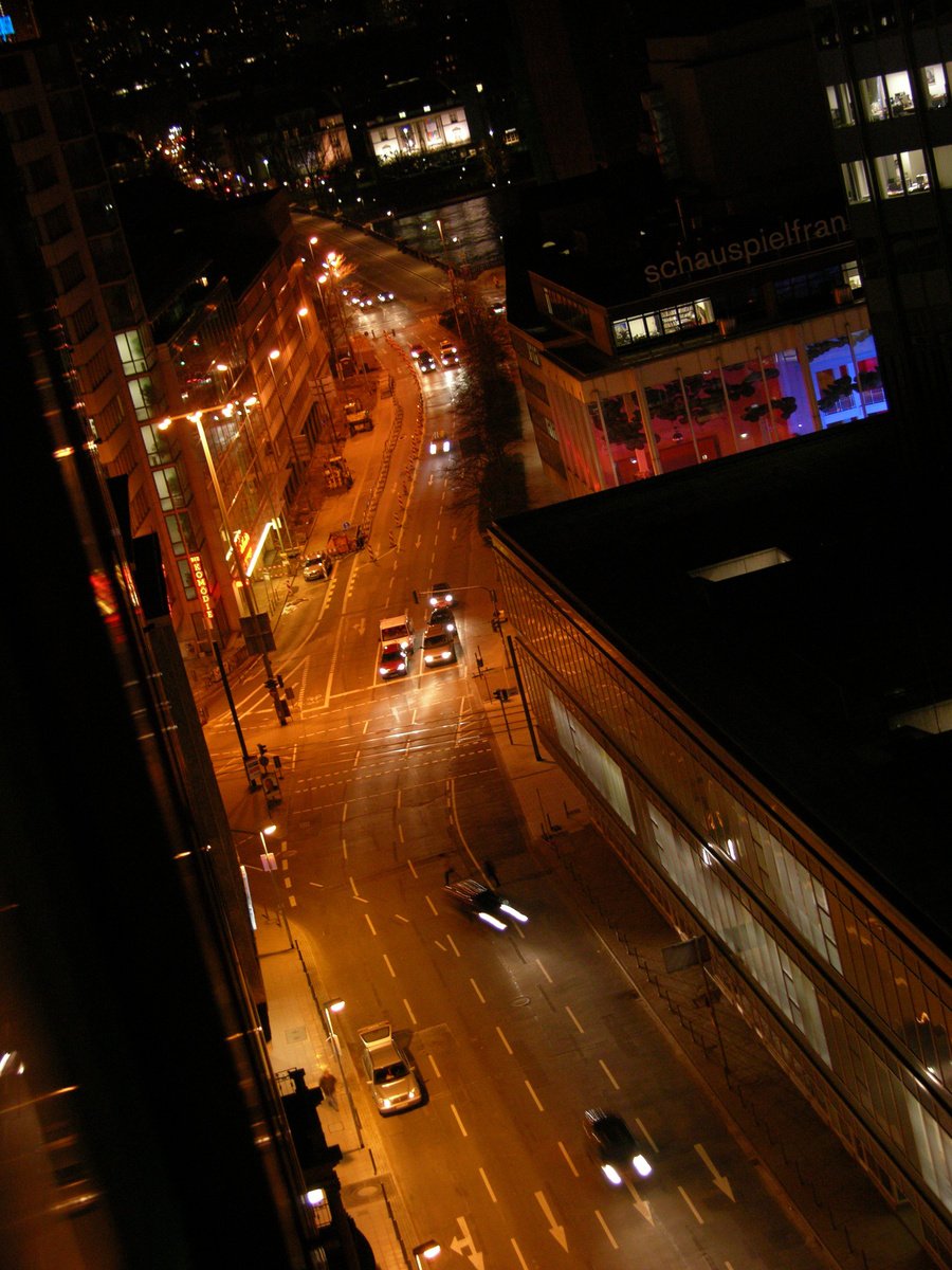 a city street at night with many traffic
