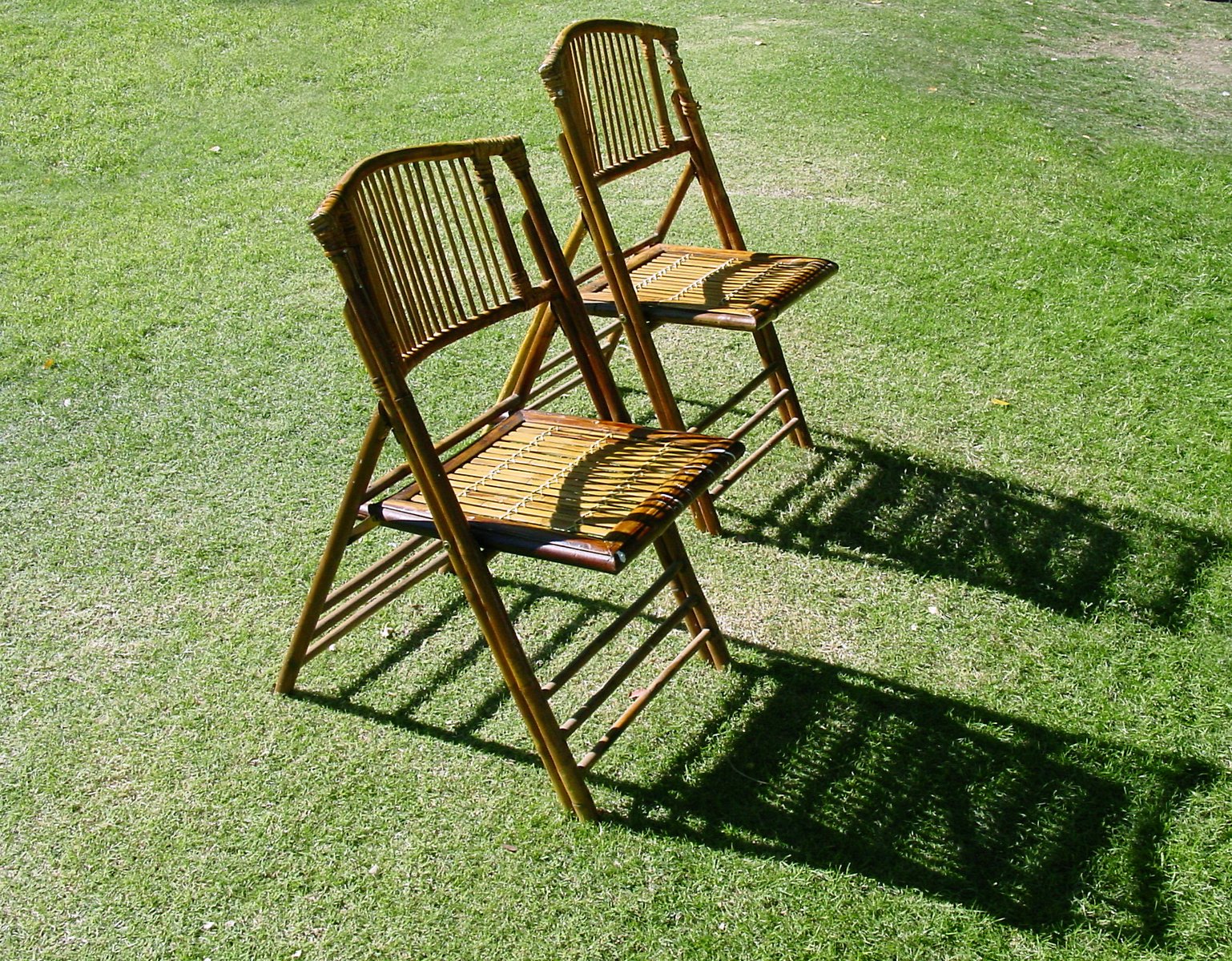 two chairs are sitting in the middle of the field