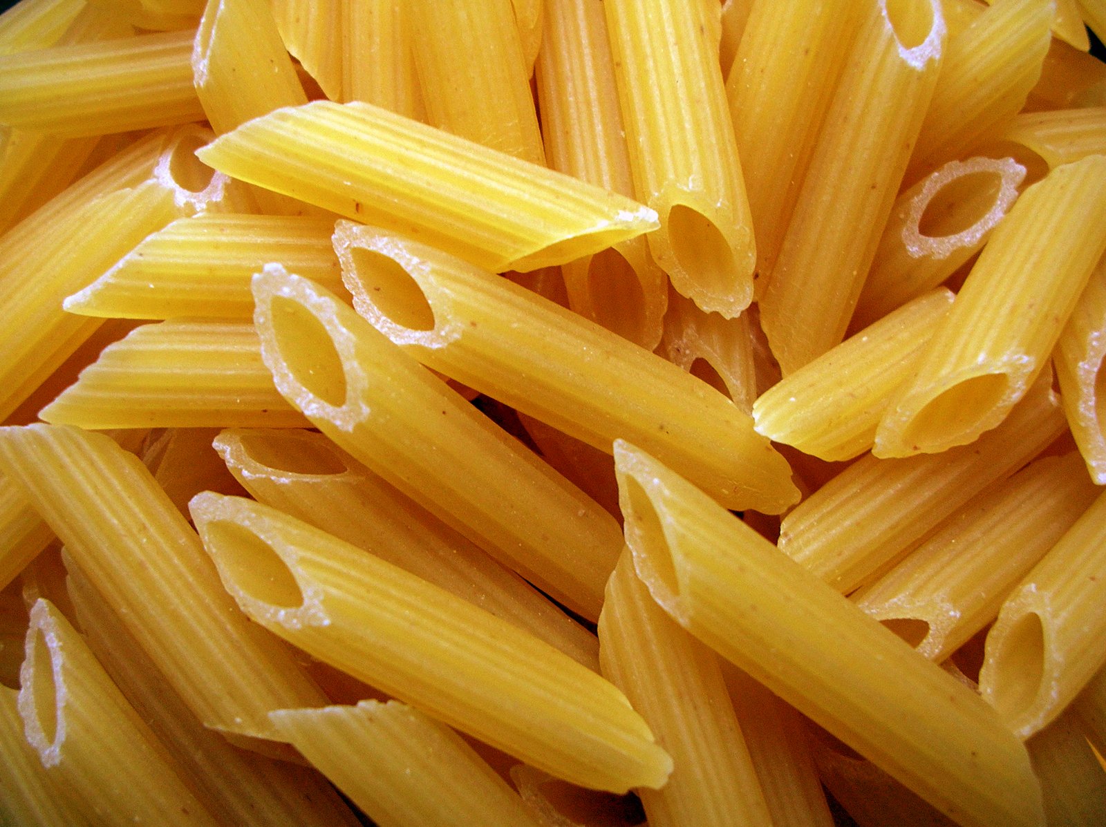 a close up of pasta being tossed with salt