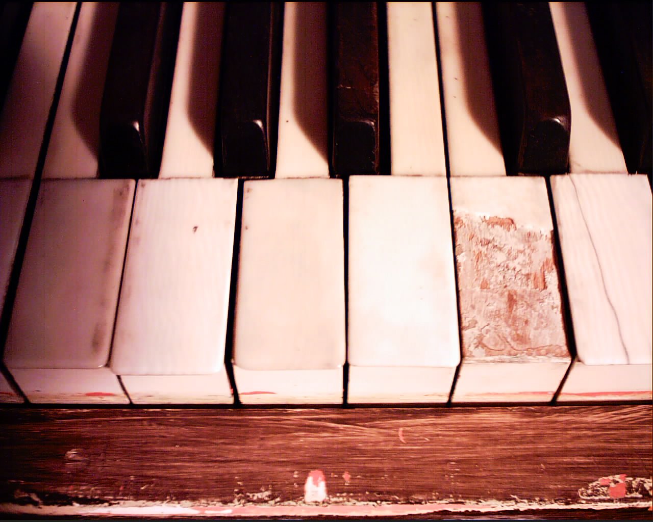 a piano keyboard with some little writing on it