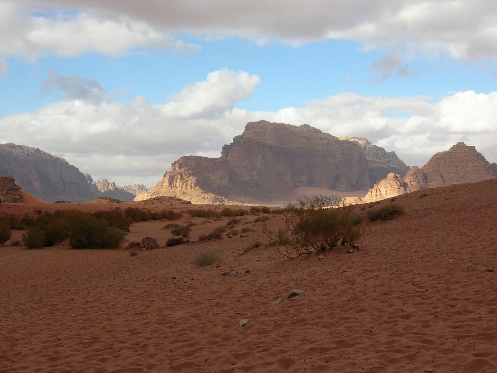 some very big mountains in a desert