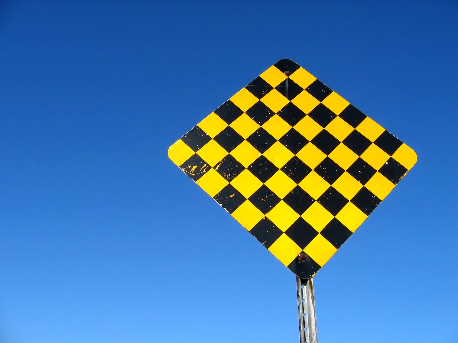 a close up of the base of a traffic sign