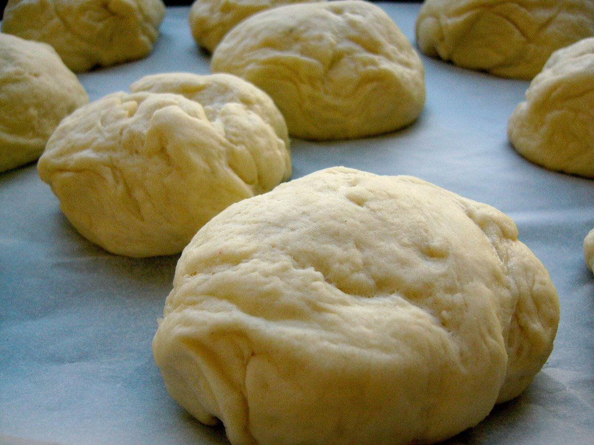 a number of doughs on a pan ready to be baked