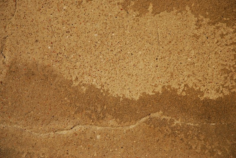 a close up image of sand on the ground