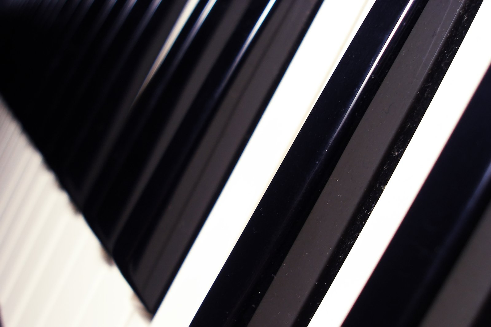 the image shows a long and close band piano