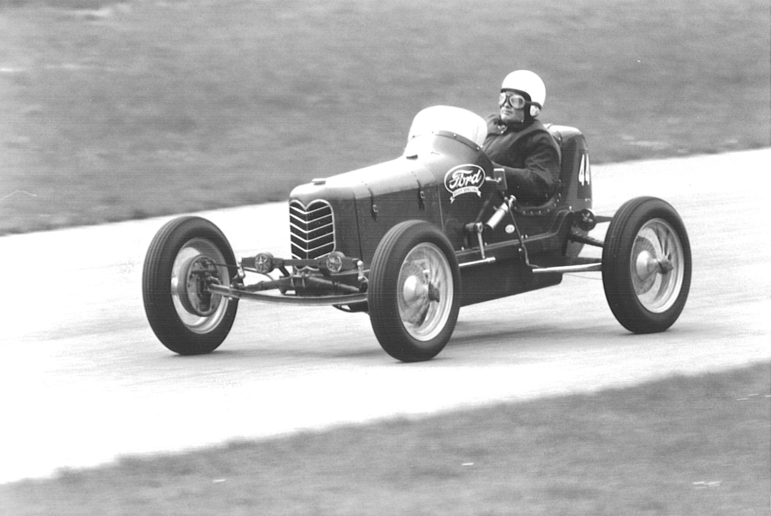 an old style  rod is driving on a track