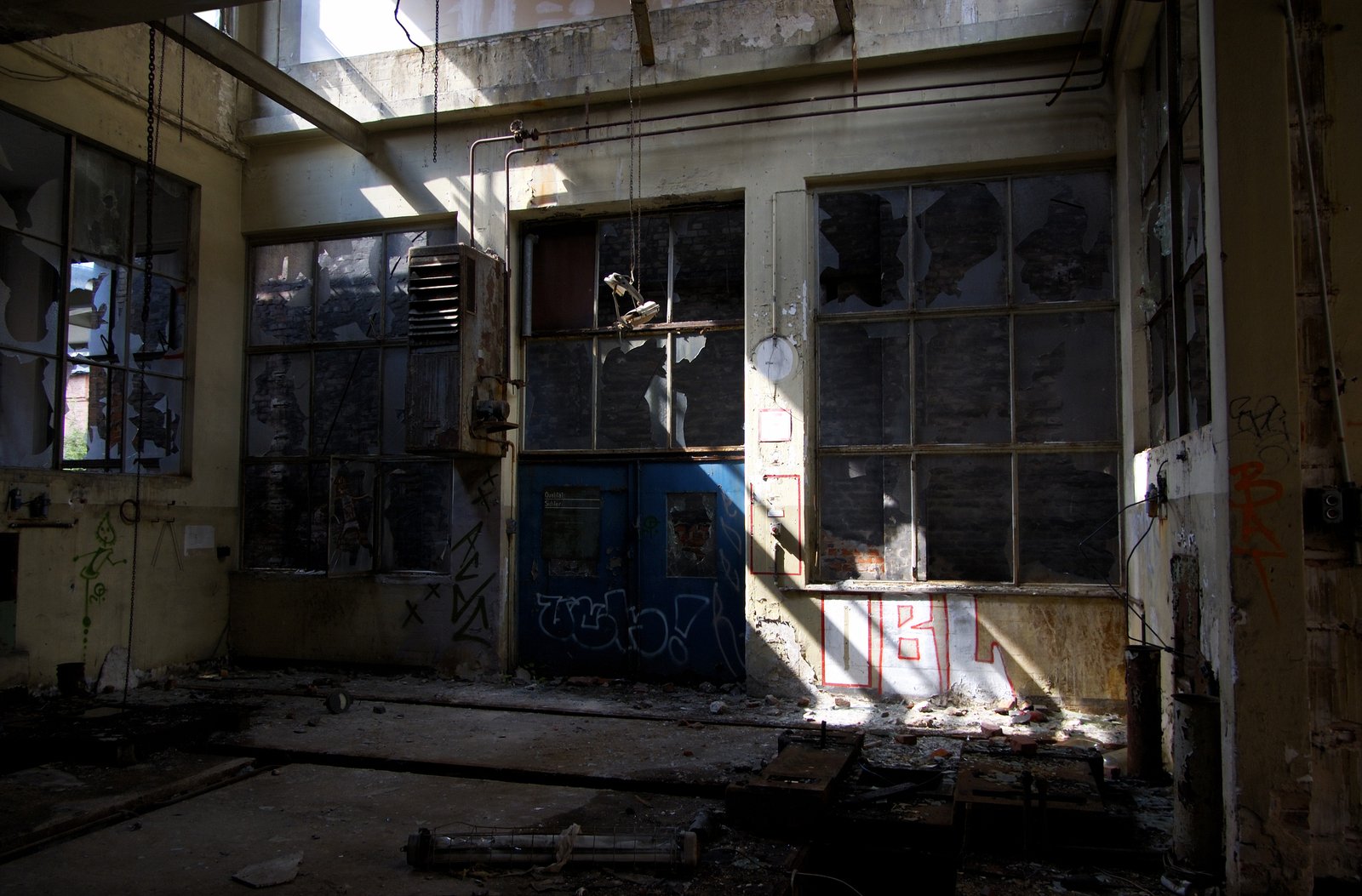 the abandoned building has been boarded open by the fire