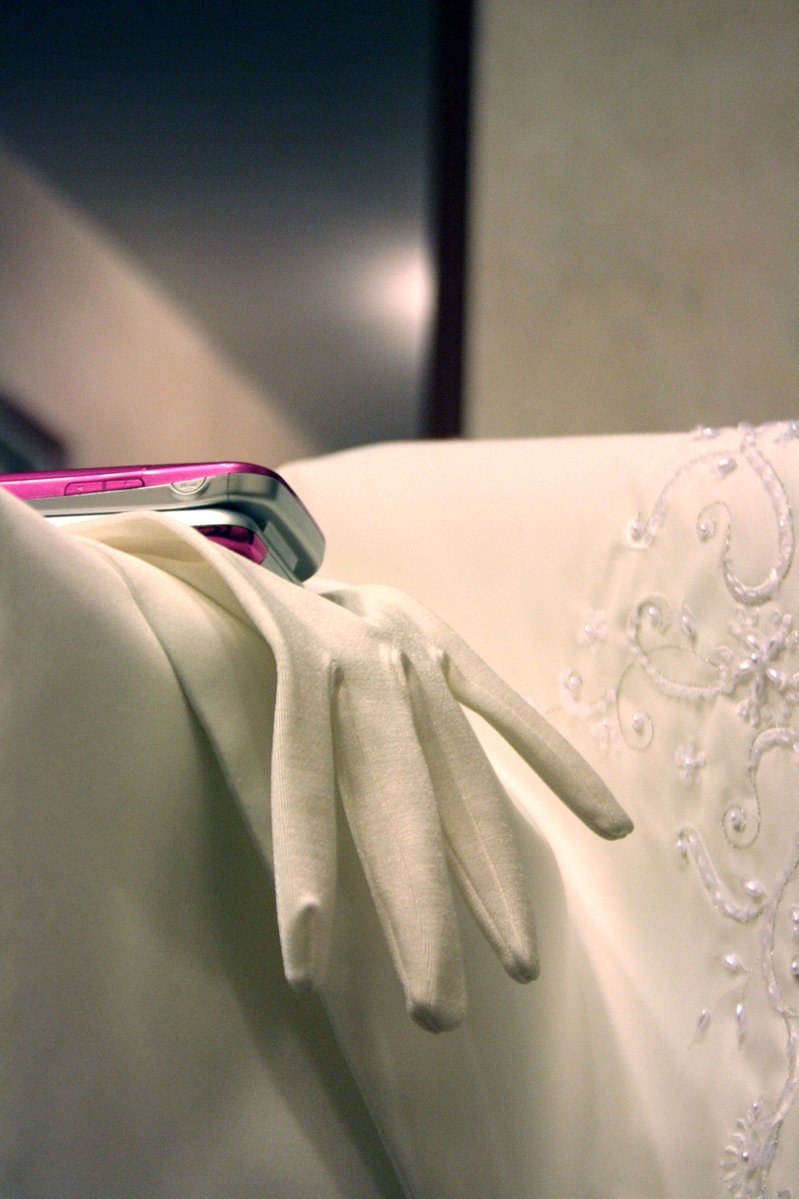 a white and silver tie on a white dress