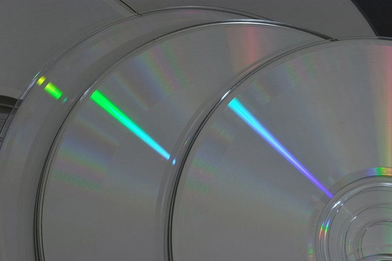 an array of cd disc discs are displayed with their edges blurred off