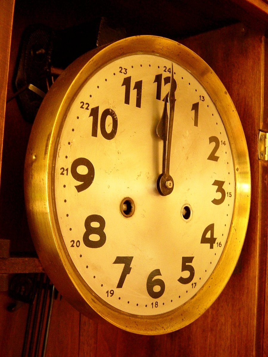an antique clock with the numbers at ten
