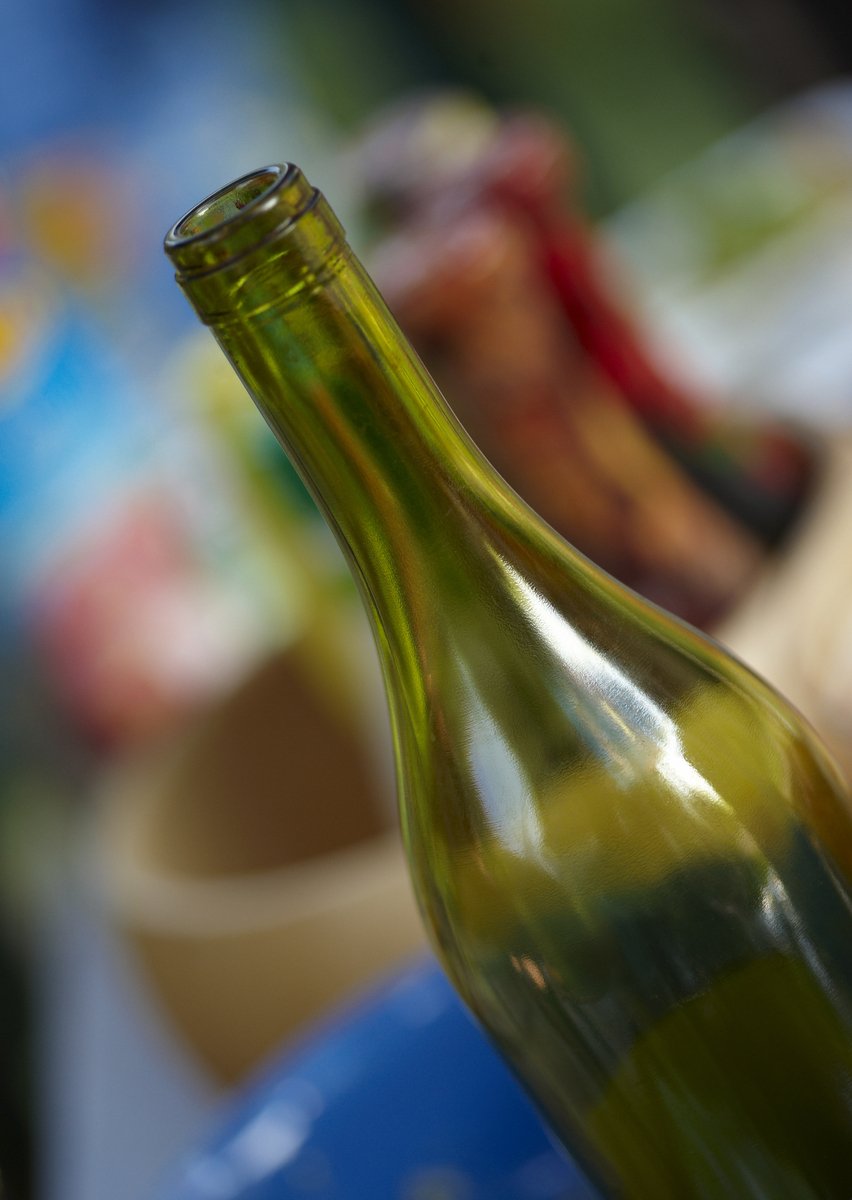 the top of a bottle in a bucket