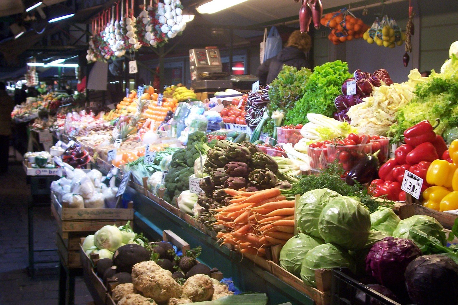 a market with many fresh fruits and vegetables on display
