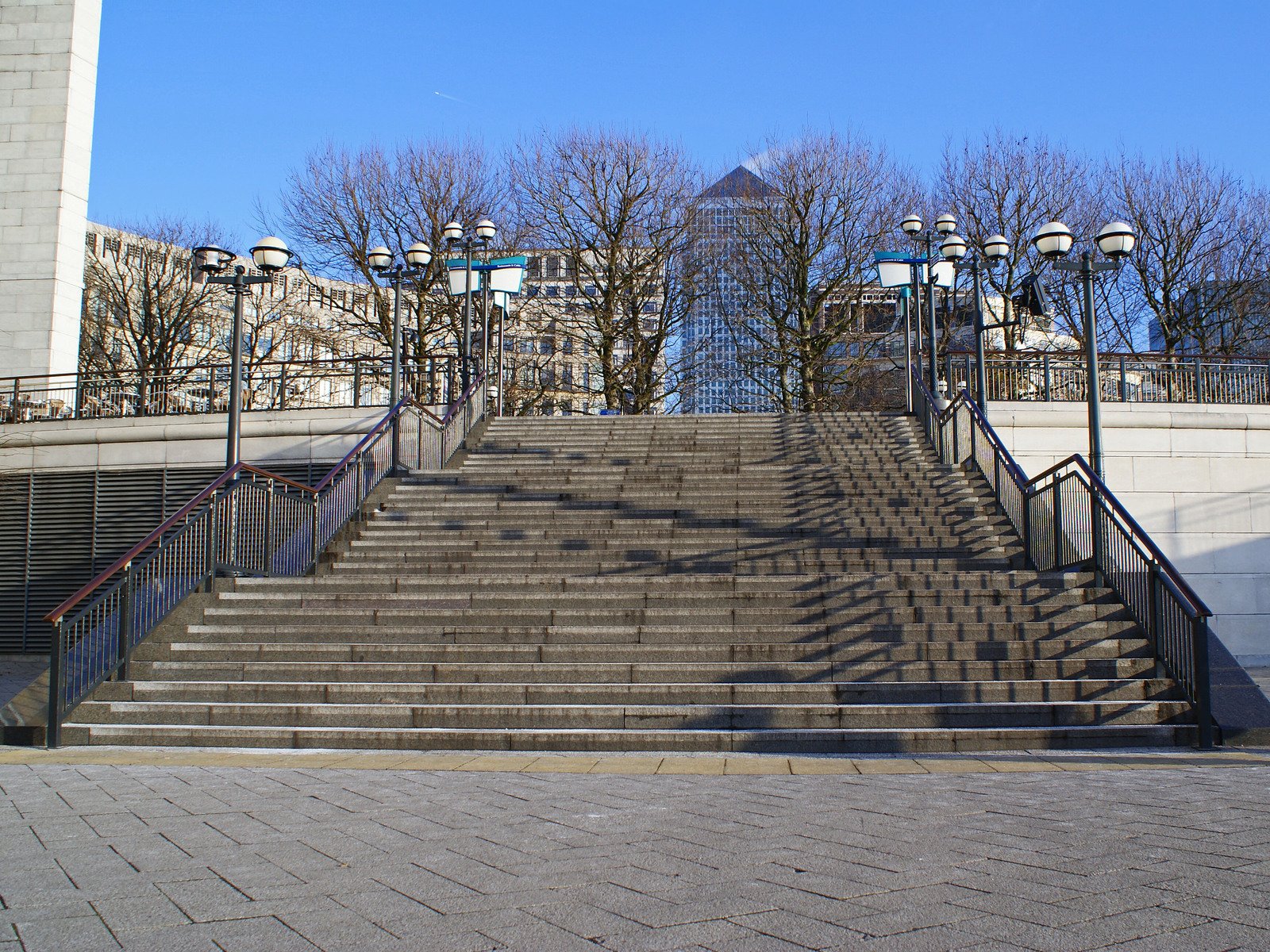 an image of stairs leading down to a large building