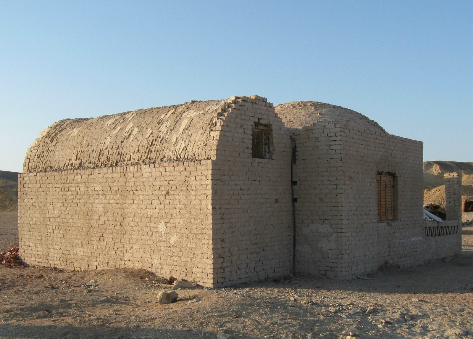 a adobe house in the middle of the desert