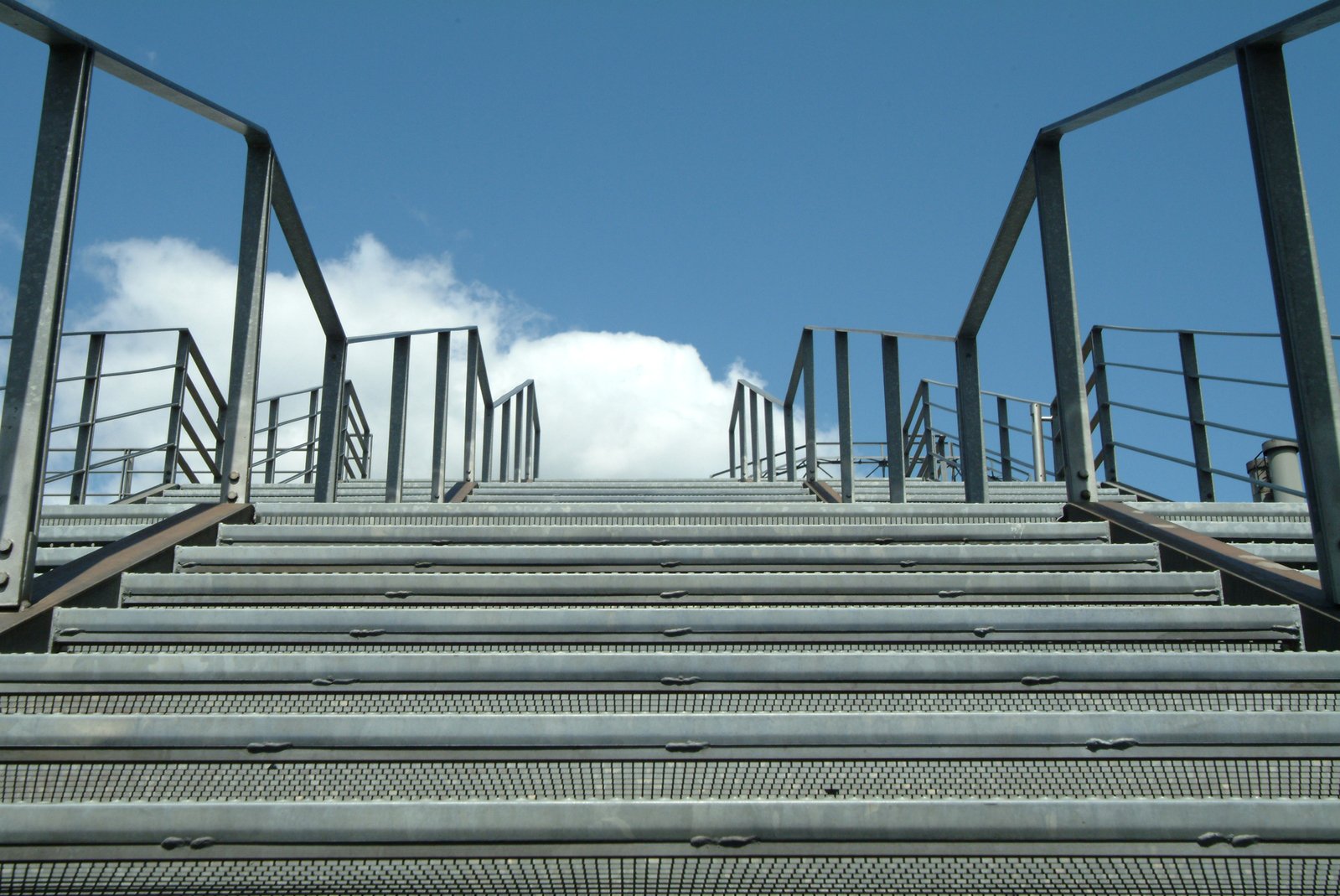 a stairway with a sky background in the day