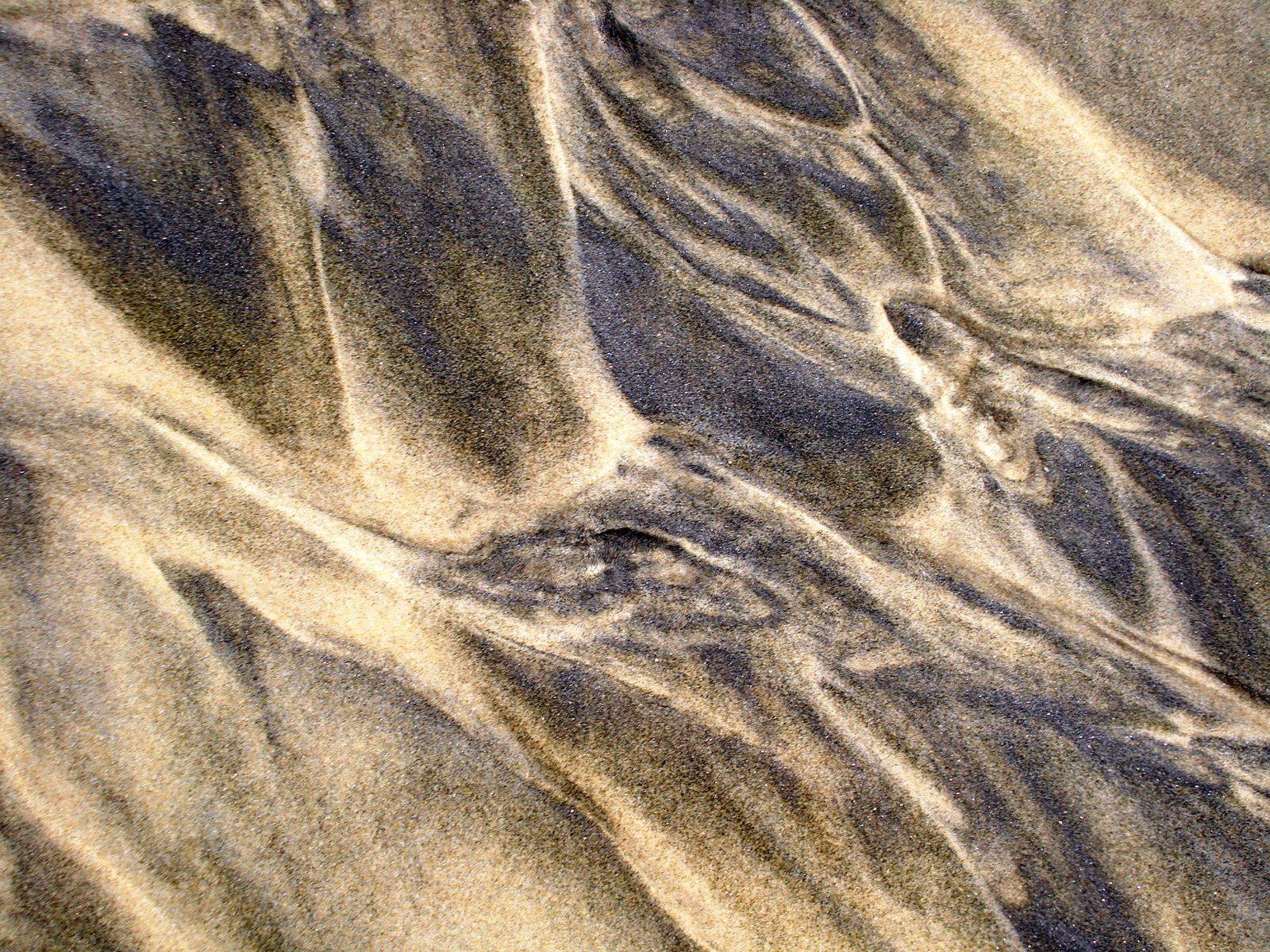 several layers of sand at a beach that appears to be very low