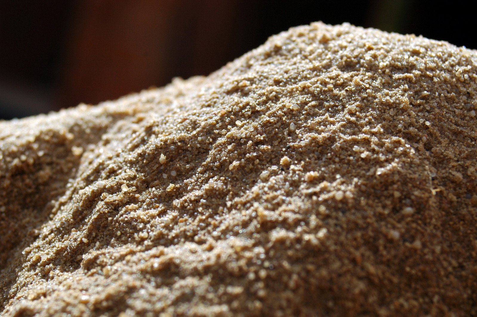 brown colored sand from above with blurry background