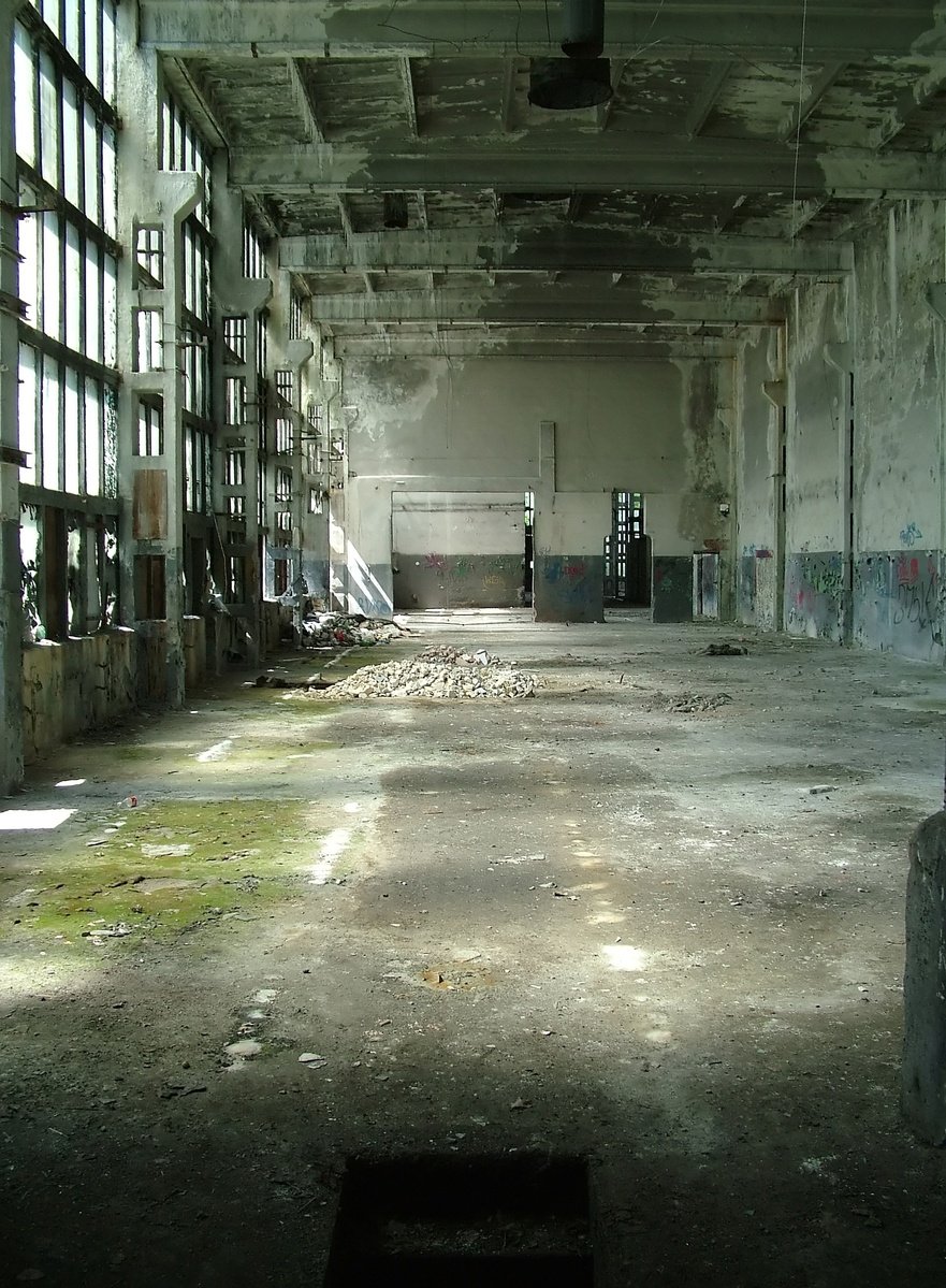 an empty room with windows, windows and graffiti