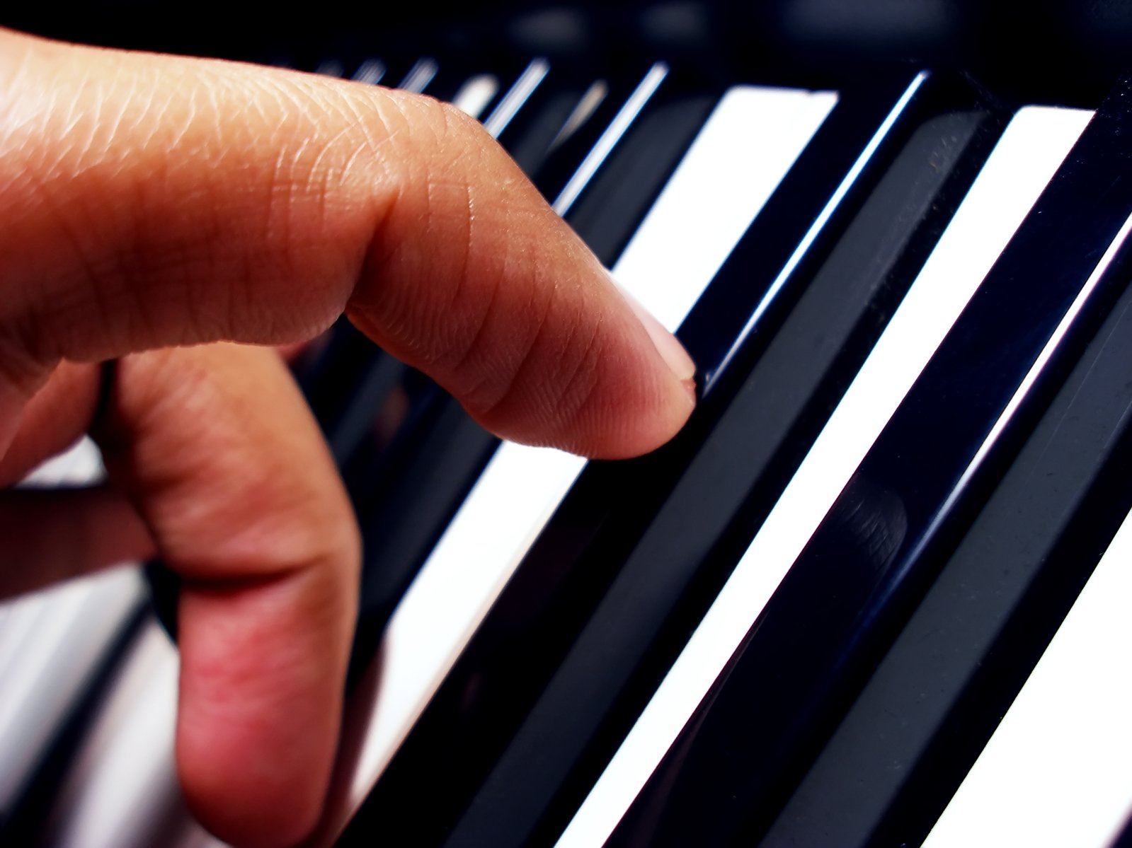 a person is clicking the sound of a piano