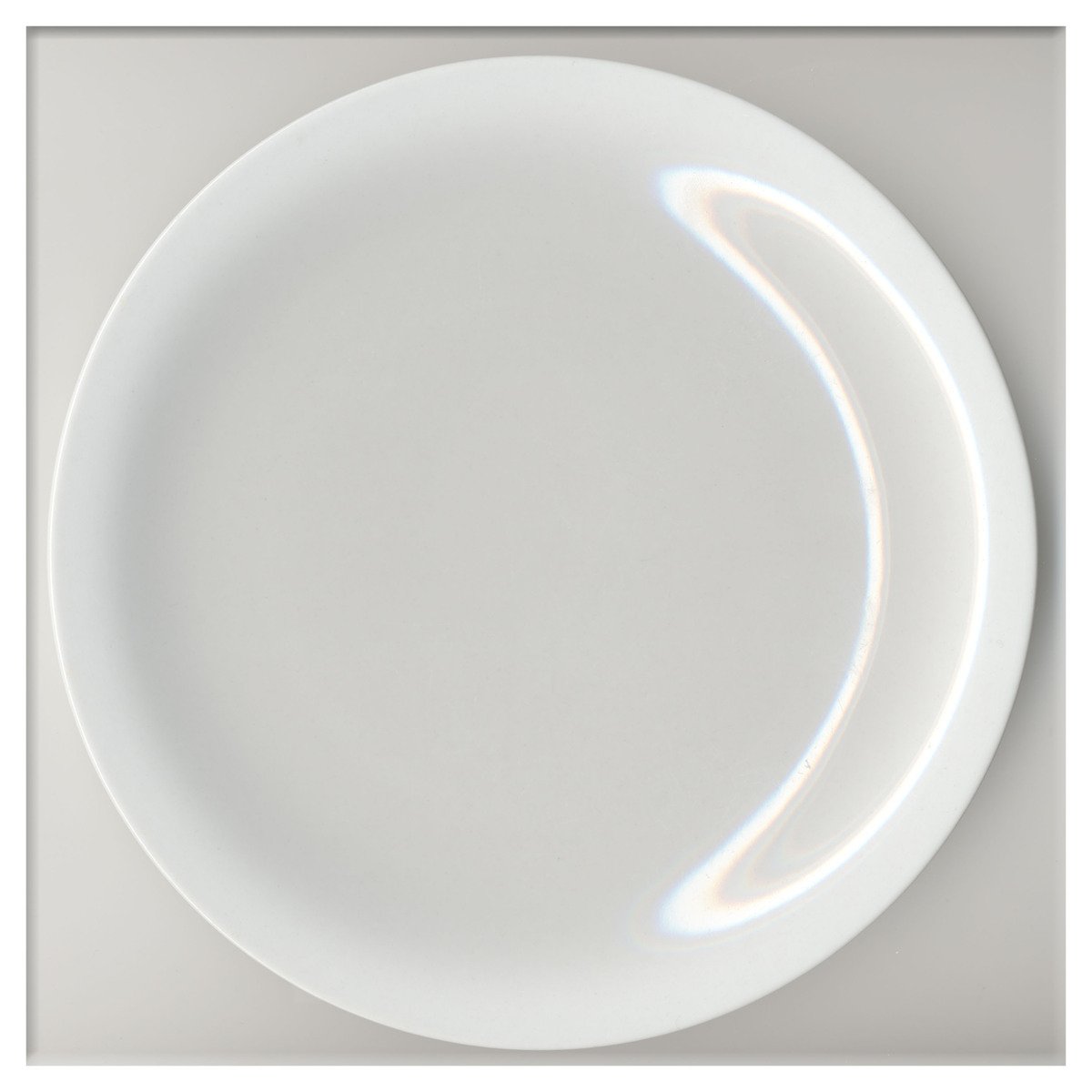 a white plate with light pouring through it