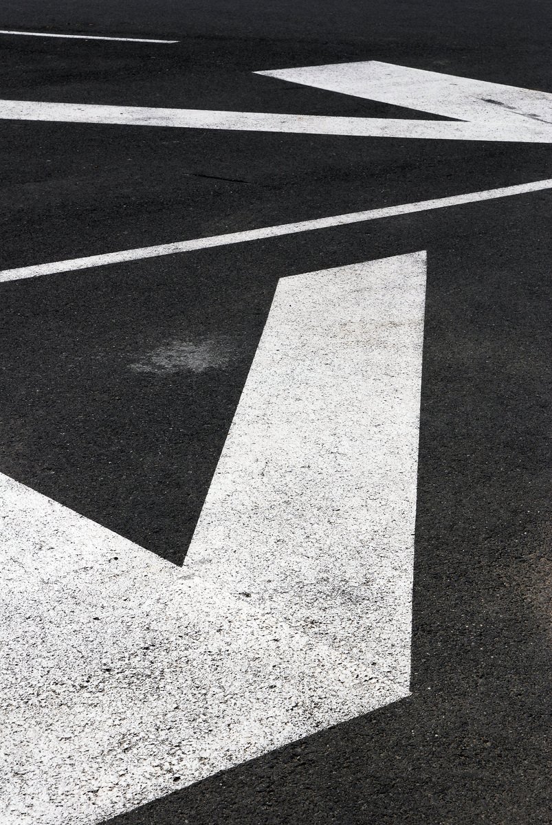 some interesting lines painted on the asphalt to look like an arrow