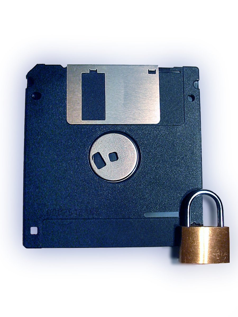 a combination lock and a disk attached to a metal padlock