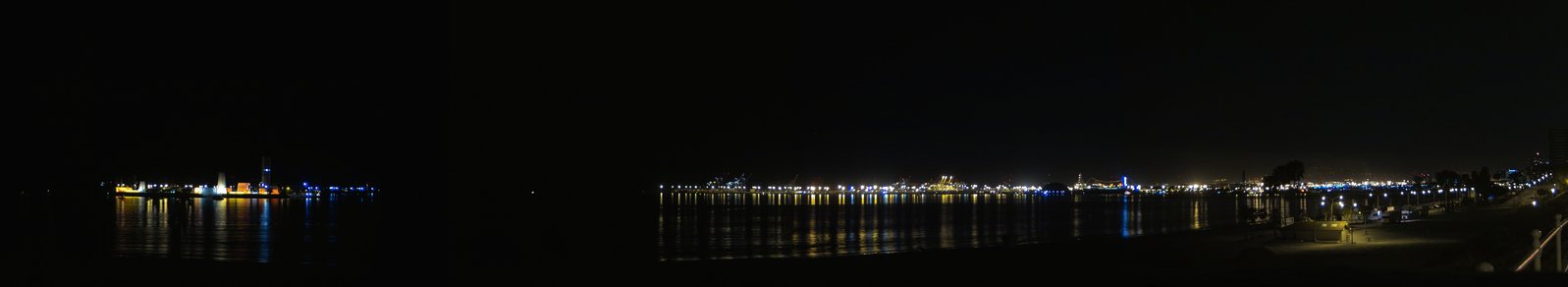 there is an island lit up at night in the ocean