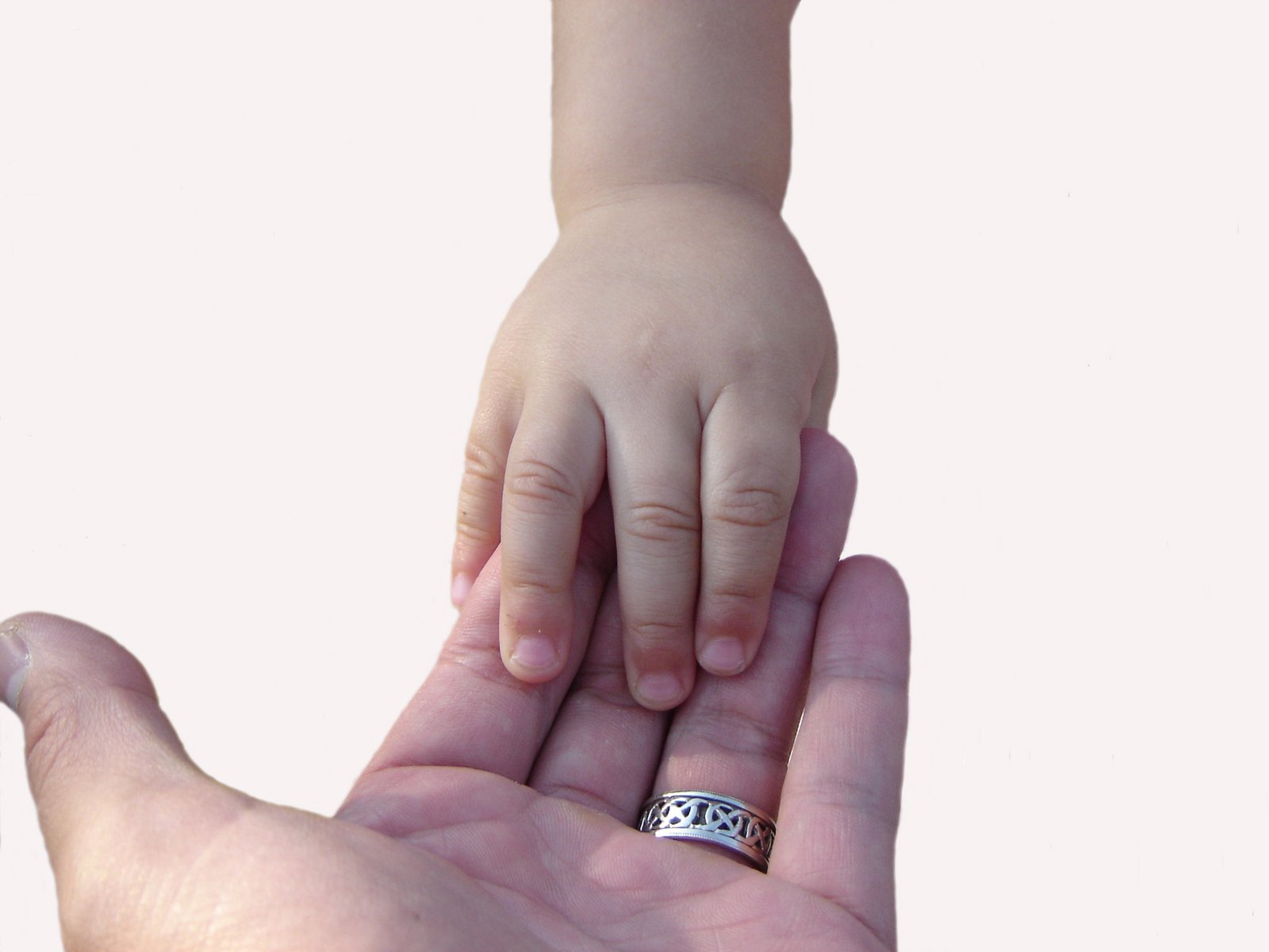 a close up of two people holding the hand of another person