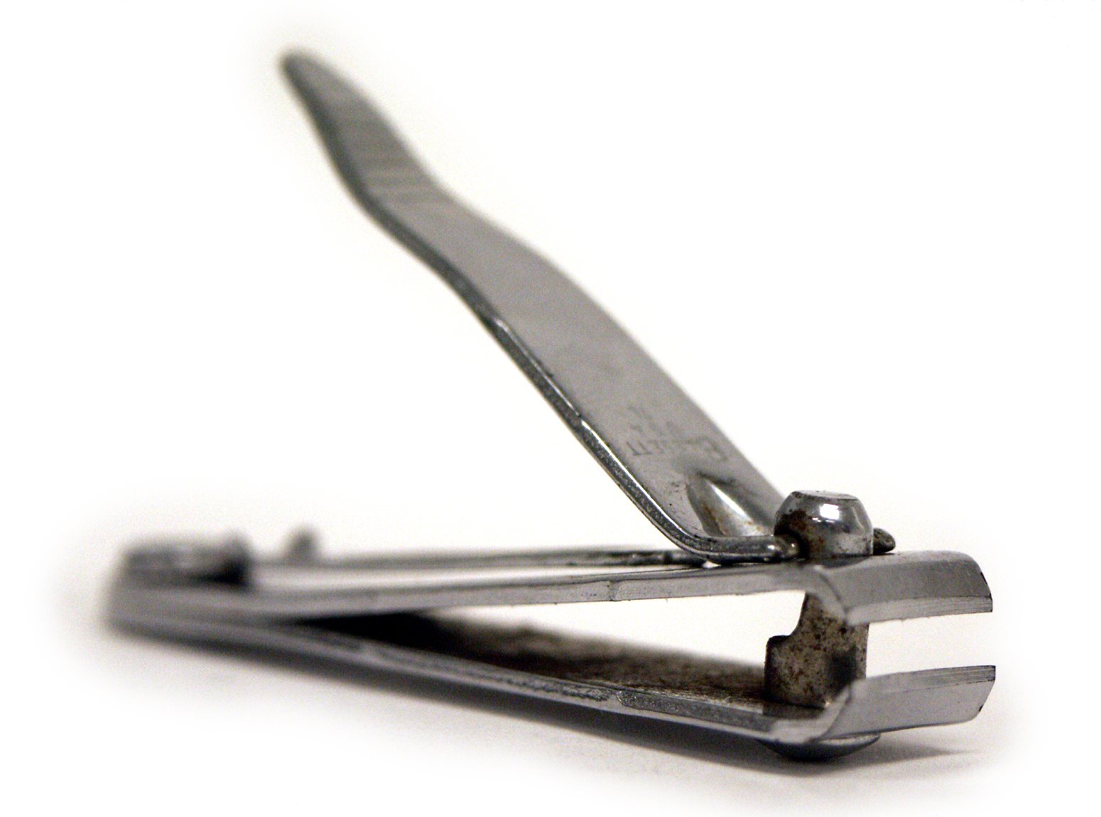 a pair of open scissors lying on top of each other