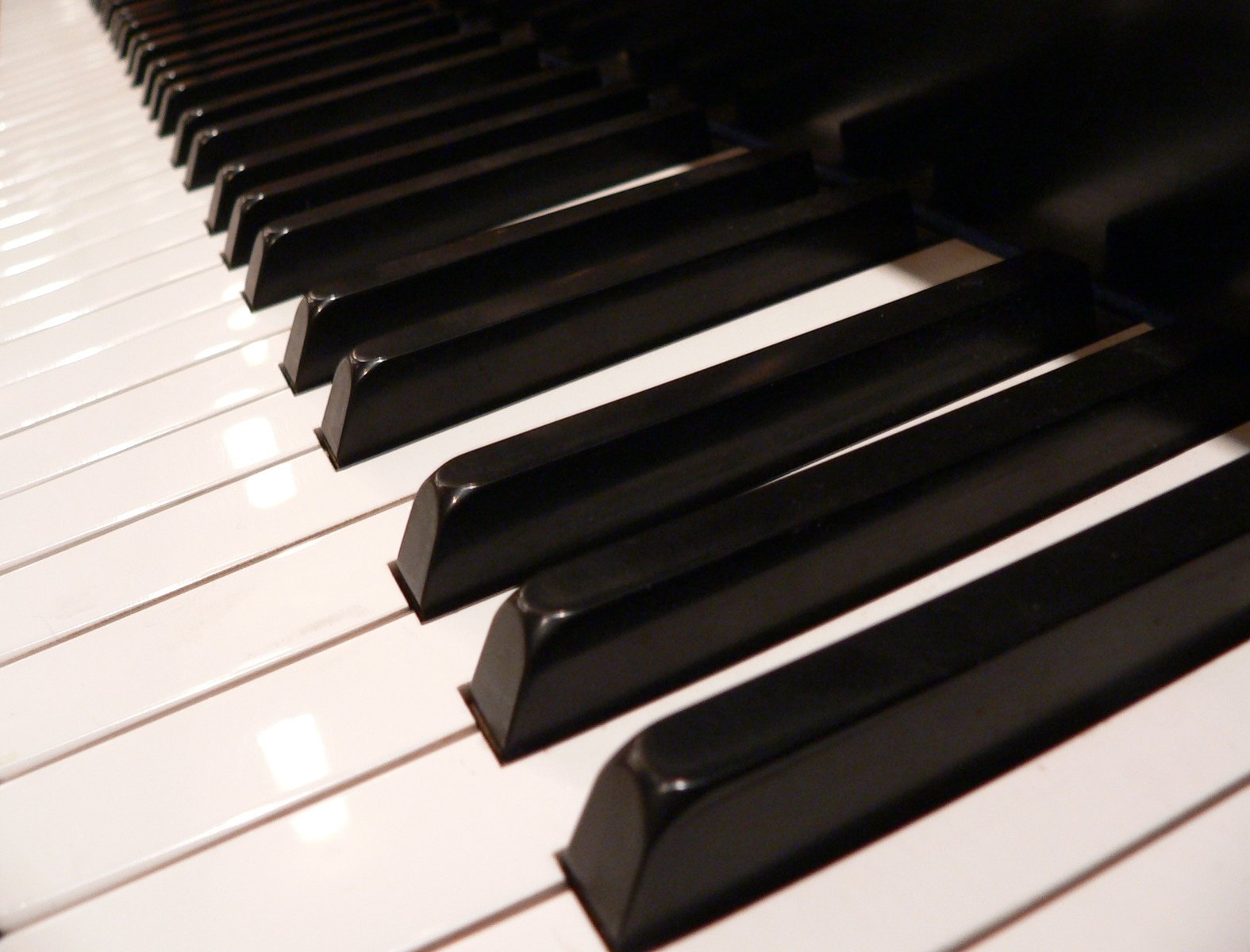 a closeup s of a piano keyboard